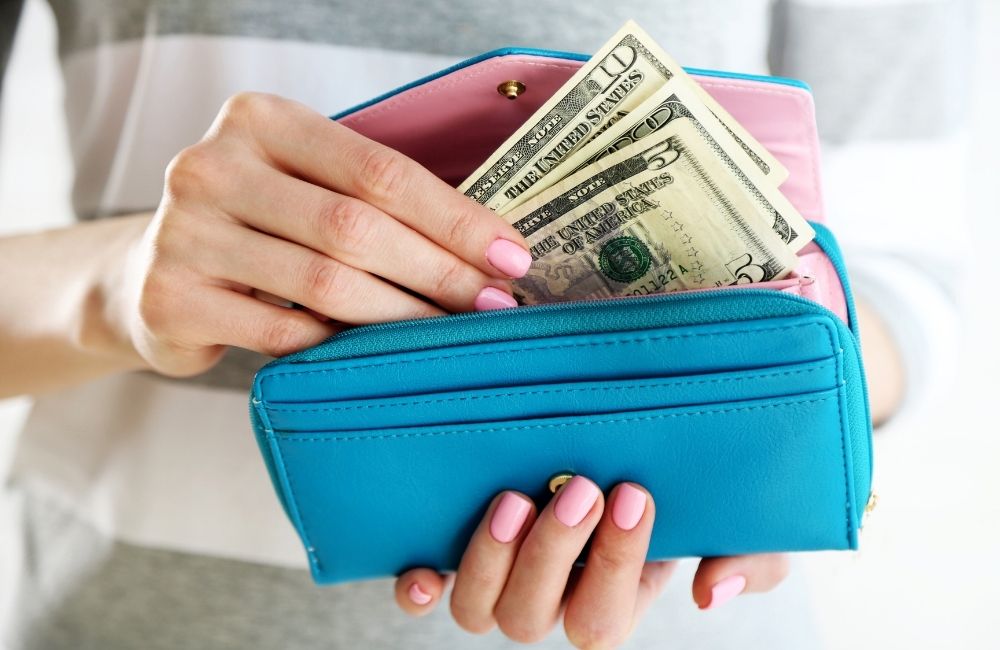 Illustration of sneaky expenses draining wallet